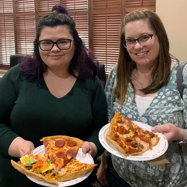 USB team members enjoying pizza.