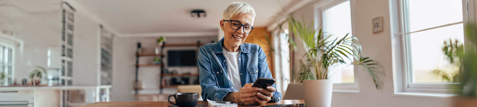 Image of a woman looking at her cellphone.