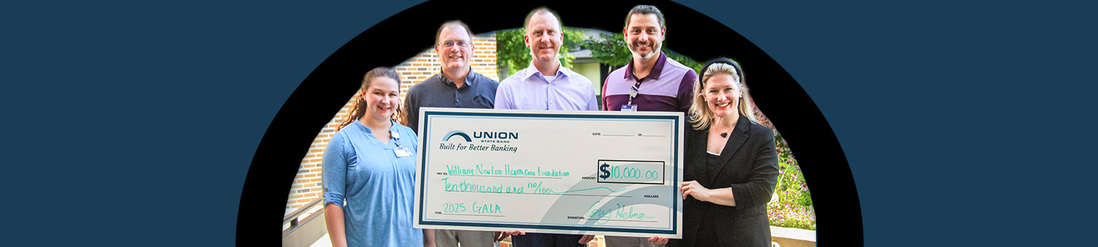 Group photo of WNH Foundation and USB staff presenting the 2025 gala sponsorship check.