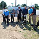 Photo of members of the Union State Bank team wearing hard hats and holding shovels for the Bartlesville branch groundbreaking ceremony.