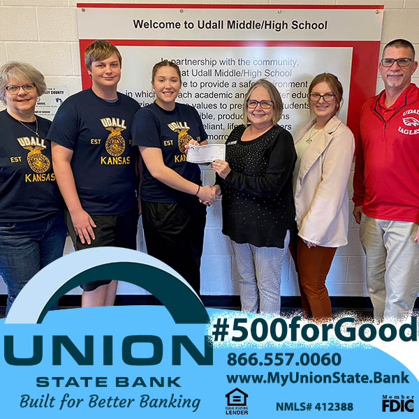 Union State Bank's Udall team present a check to members of the Udall FFA, along with Principal Chris Husselman.