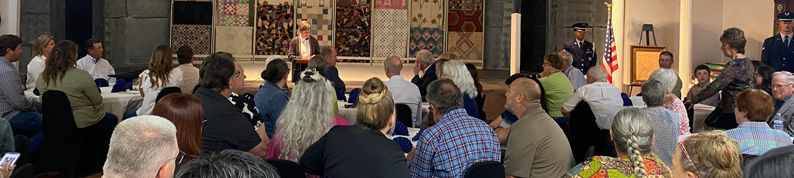 Photo of Governor Laura Kelly addressing attendees of the unveiling of the Docking Library at the Cherokee Strip Landrush Museum.
