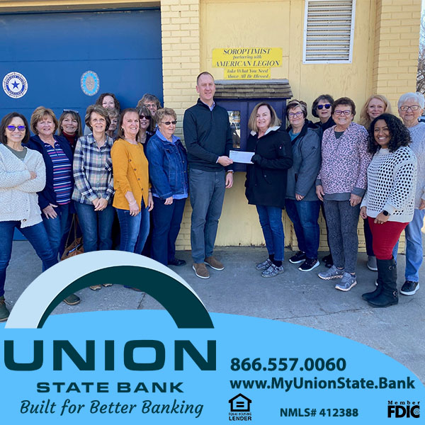 Union State Bank's Winfield Market President, Cory Helmer, presents a check to members of the Winfield Soroptimist Club.
