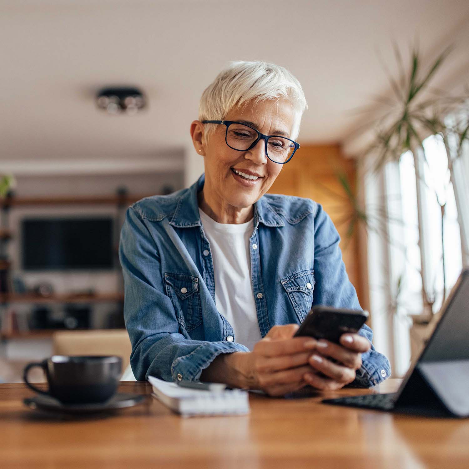 Image of a woman looking at her cellphone.