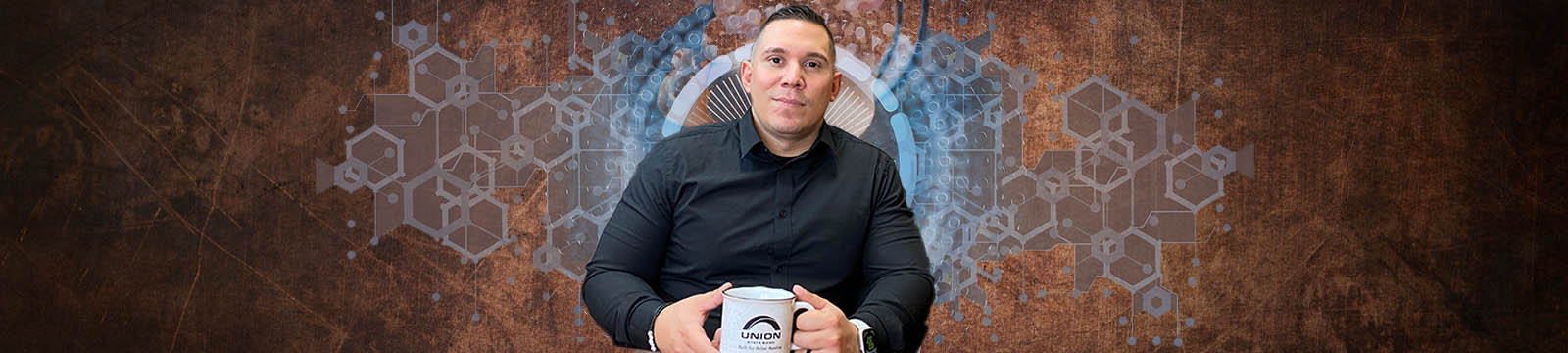 Photo of Union State bank Commercial Lender Juan Hernandez with industrial -styled graphic background.