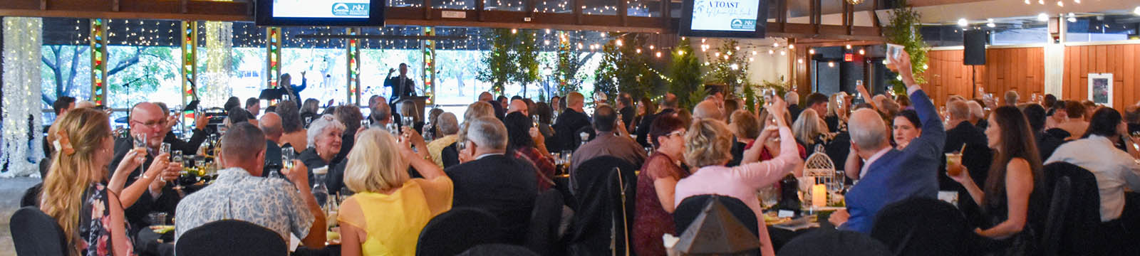 Photo of gala attendees toasting Dr. Alvin Bird for receiving the 2026 Union State Bank Healthcare Hero award.