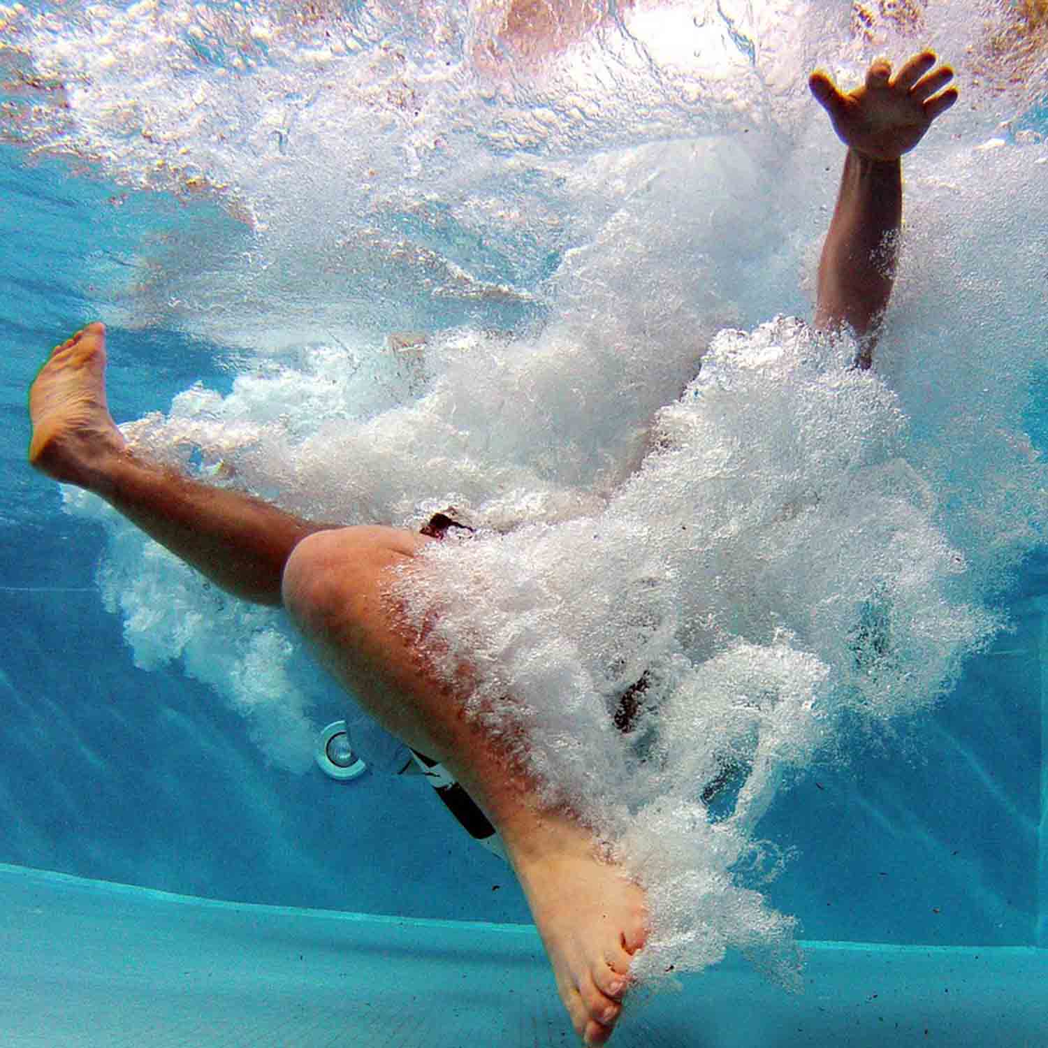 Underwater photo of person in a swimming pool.