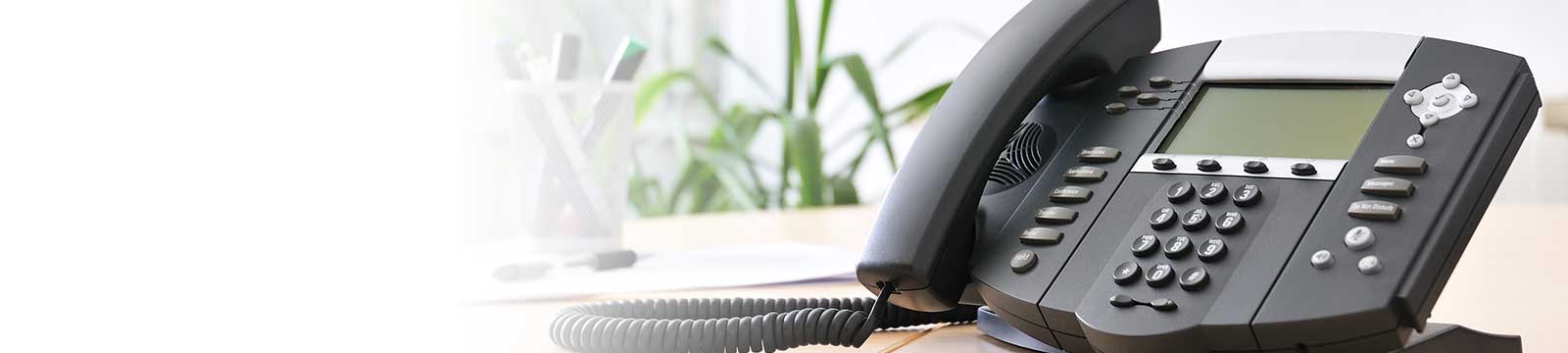 Office telephone sitting on a desk