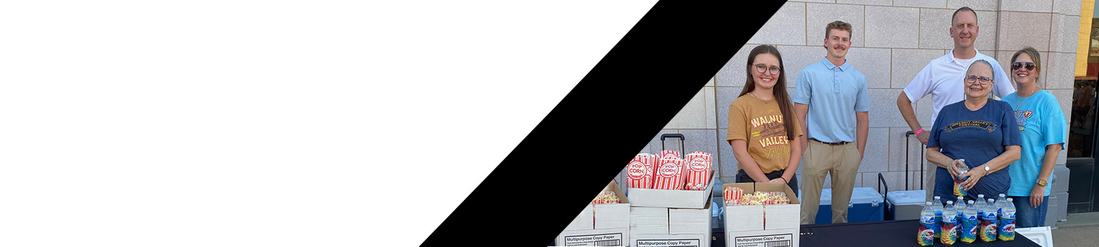 Photo of a group of Union State Bank employees at the bank's booth during a community event.