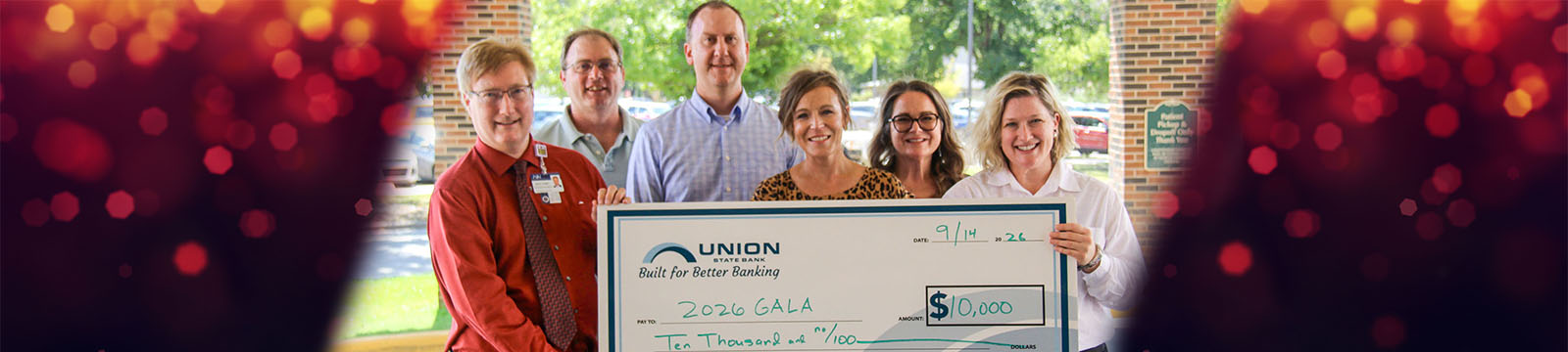 Photo of a check presentation by Union State Bank staff to members of the William Newton Healthcare Foundation.