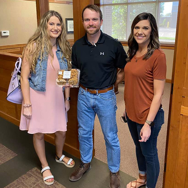 The Winfield South team holding a box of cookies.