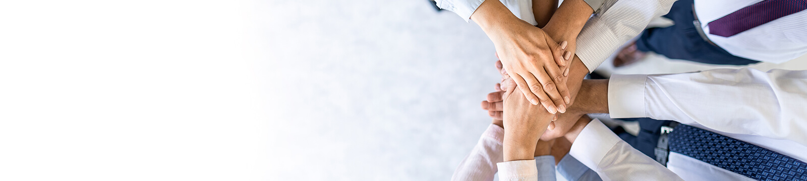 Image of coworkers with hands together for teamwork