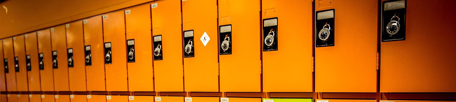 Photo of a row of orange lockers.