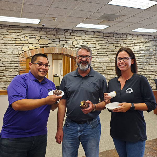 USB staff enjoying National Donut Day.