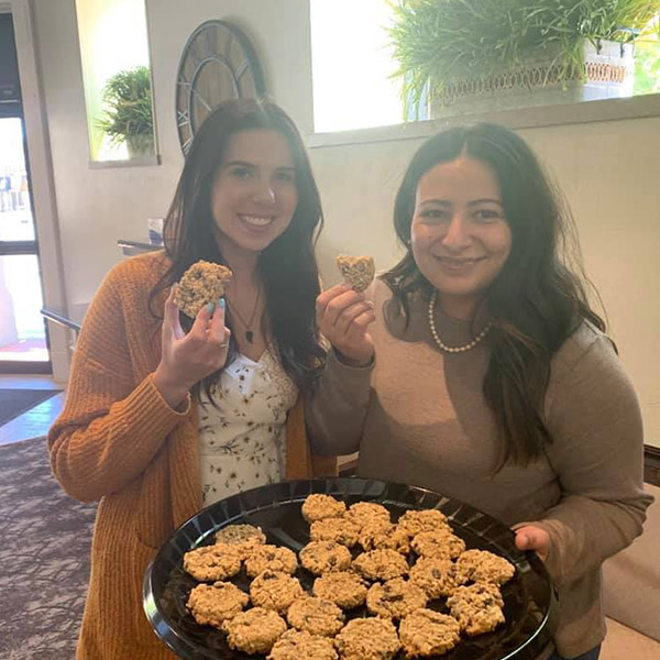 The Ark City main team holding a plate of cookies.