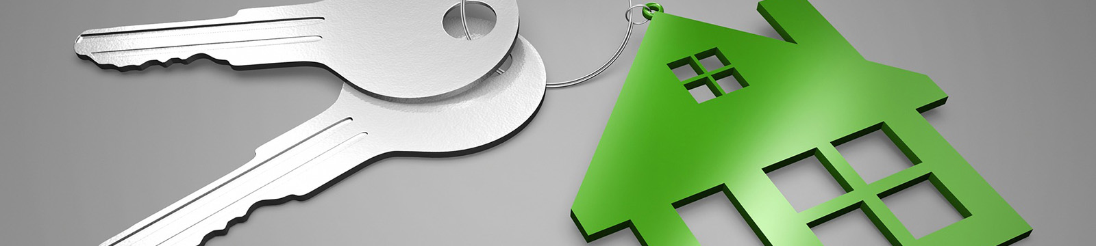 Image of a pair of keys with green, house-shaped keychain. First time home buyer mortgage program for Kansas and Oklahoma.