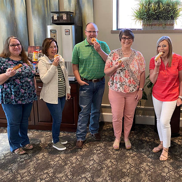 USB staff enjoying National Donut Day.