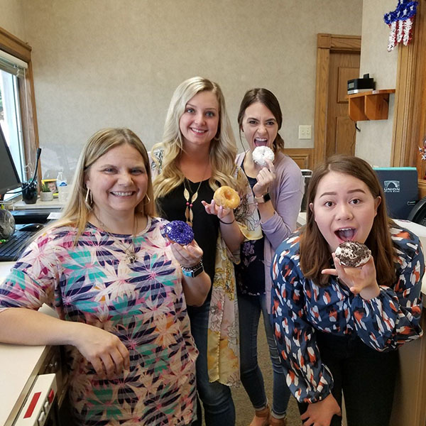 USB staff enjoying National Donut Day.