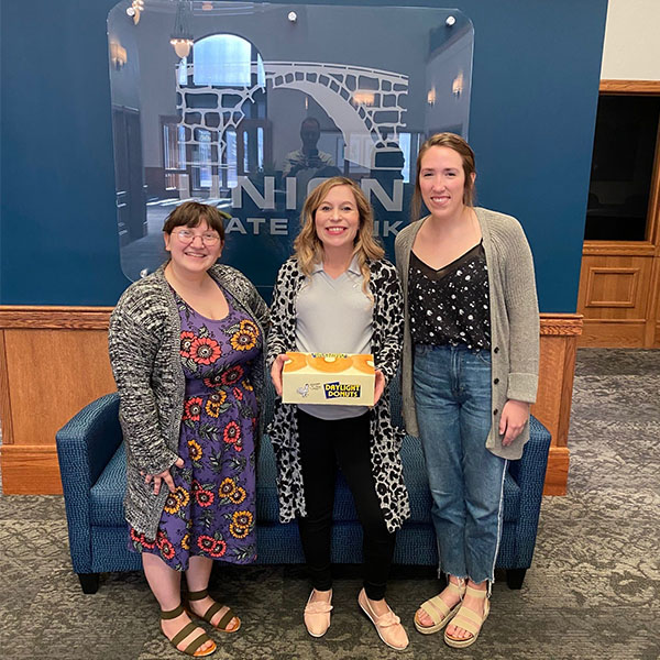 USB staff enjoying National Donut Day.