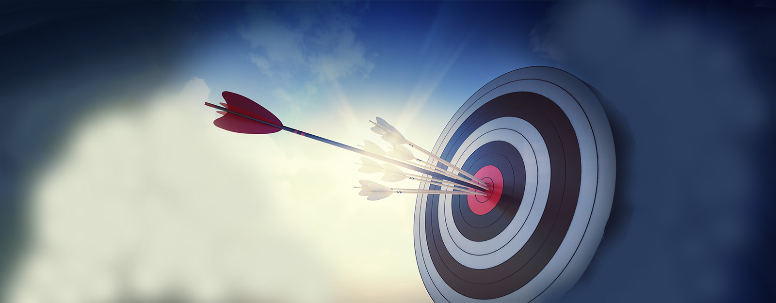 Image of a target with several small arrows and one large arrow hitting the bullseye. cloud background.