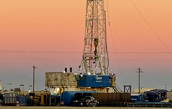 Photo of a Quest Drilling rig out in the field.