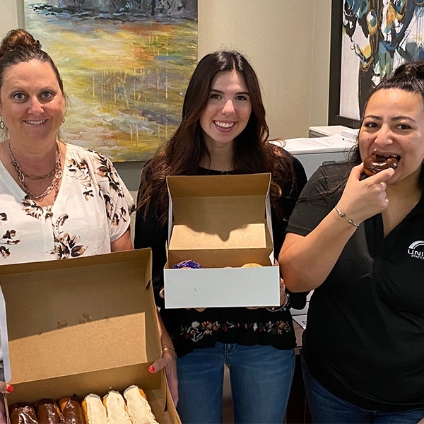 USB staff enjoying National Donut Day.