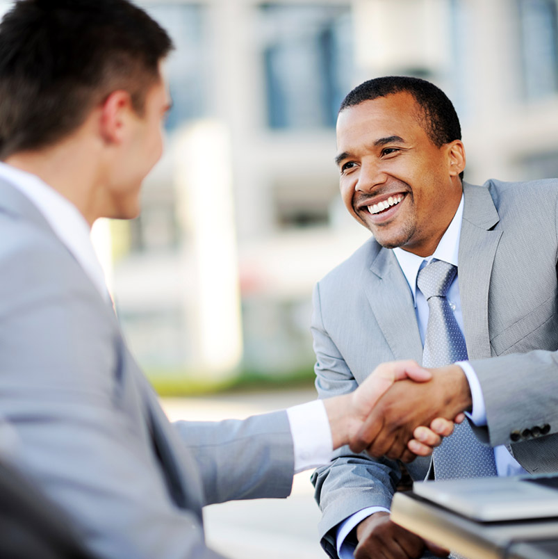 Photo of two men in business attire shaking hands. Union State Bank Treasury Services, CDARS.